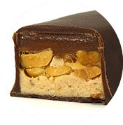 Cut piece of a Jokerz bar showing the peanut, nougat and caramel