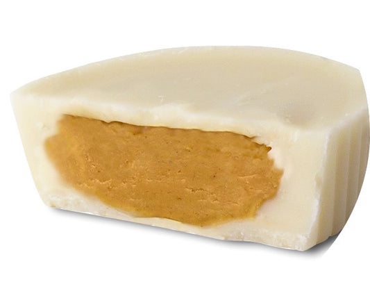 Cut piece of a vegan white chocolate Cleo pb cup