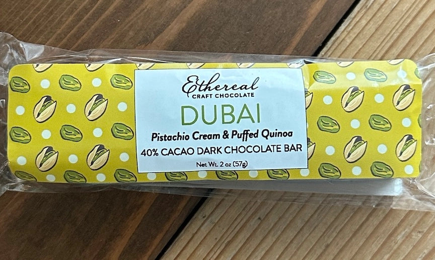 Ethereal Vegan and Dairy Free Craft Chocolate bar with pistachio and quinoa flavor on a wooden surface