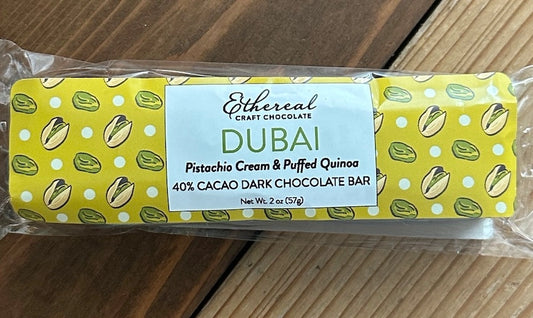 Ethereal Vegan and Dairy Free Craft Chocolate bar with pistachio and quinoa flavor on a wooden surface
