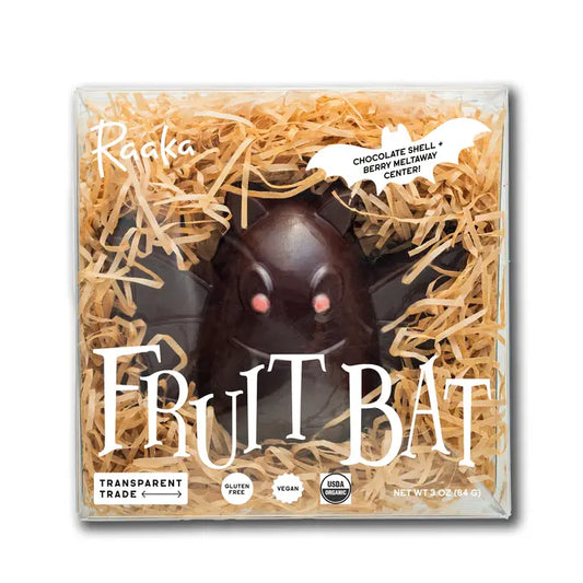 Raaka Vegan/Dairy Free Chocolate fruit bat in a clear box with straw-like material on a white background