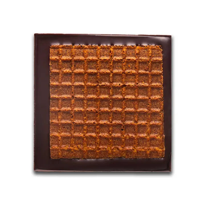 Unwrapped vegan/dairy free chocolate waffle bar square with dark chocolate coating on the back and sides.